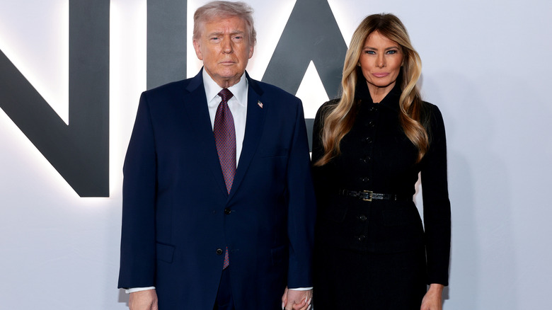 Donald and Melania Trump standing together film premiere