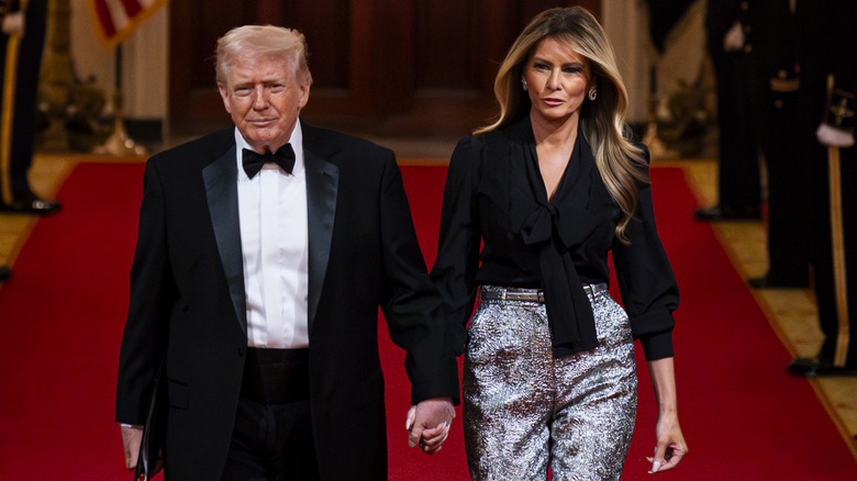 Donald and Melania Trump silver pants on red carpet