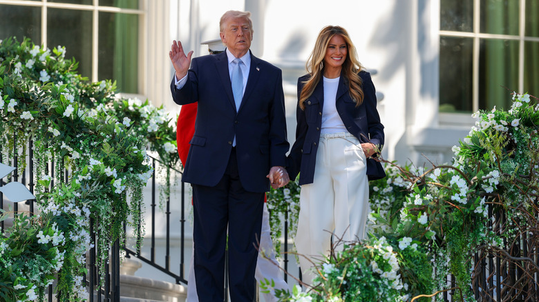 Donald Trump waving with Melania on stairs Easter 2026