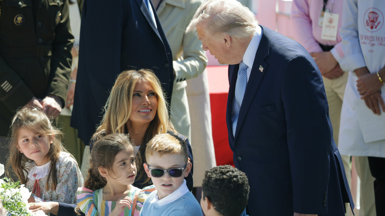 Donald Trump talking to Melania seated at Easter Egg Roll