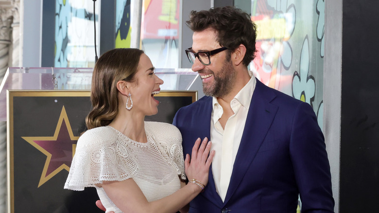 Emily Blunt laughing and smiling with John Krasinski