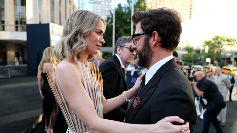 Emily Blunt and John Krasinski looking at each other
