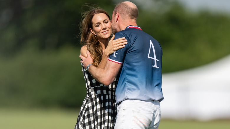 Prince William kissing Princess Catherine on the cheek