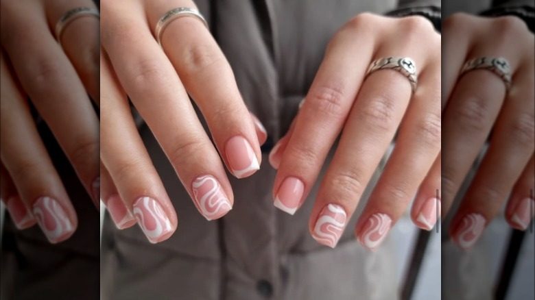 Beautiful manicure of soft lilac color on short square nails. Manicure for  women with a gel polish coating with a black inscription 23164929 Stock  Photo at Vecteezy