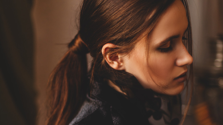 Woman with low ponytail