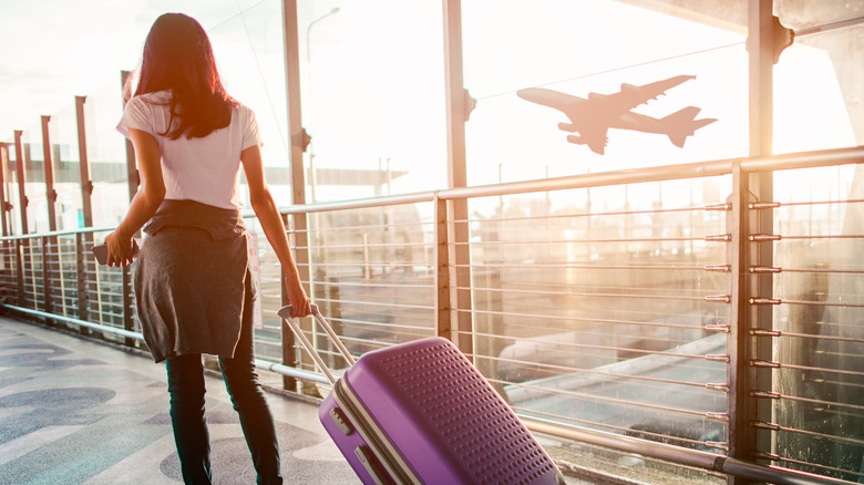 Woman walking through an airport