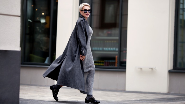 Woman in gray and black outfit