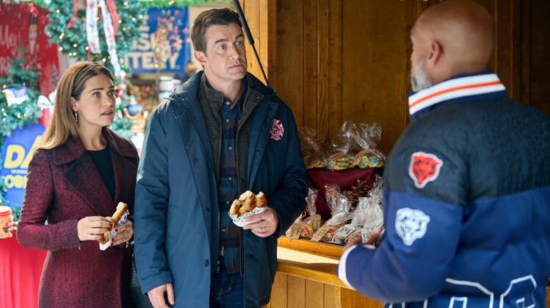 Lyndsy Fonseca and Robert Buckley in "Holiday Touchdown: A Bears Love Story"