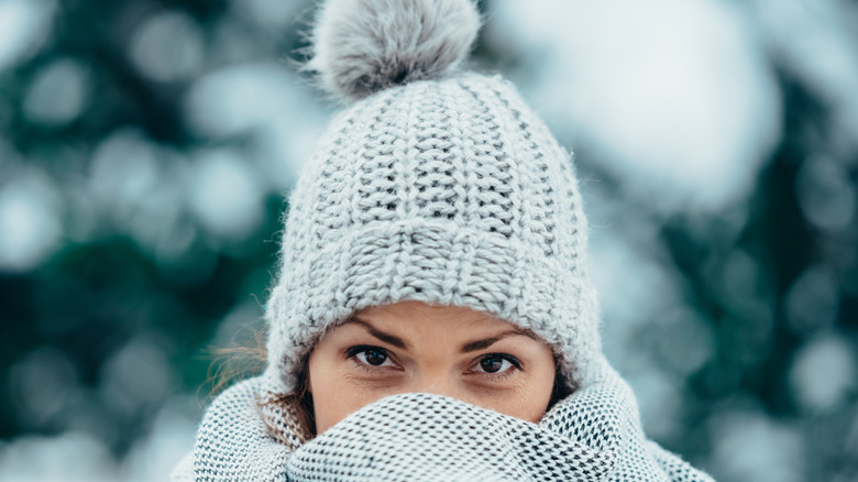Woman bundled up in the cold 