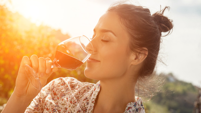 Woman appreciating a glass of wine