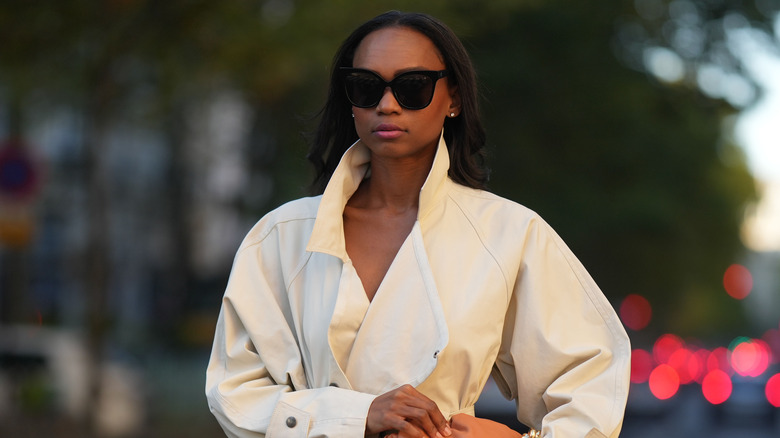 woman wearing jacket and sunglasses