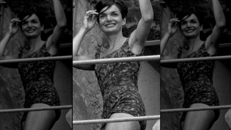 Jackie Kennedy smiling in a bathing suit