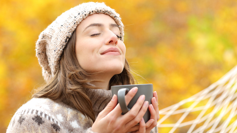 A smiling woman outdoors smiling