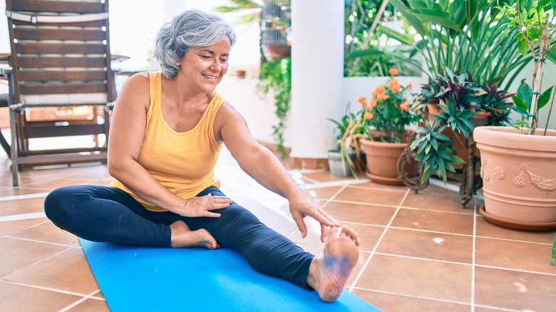 Older woman on a mat