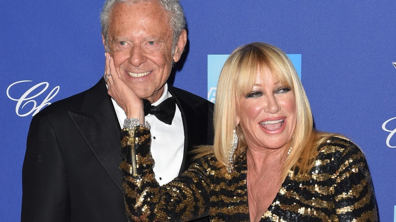 Suzanne Somers touching Alan Hamel's face