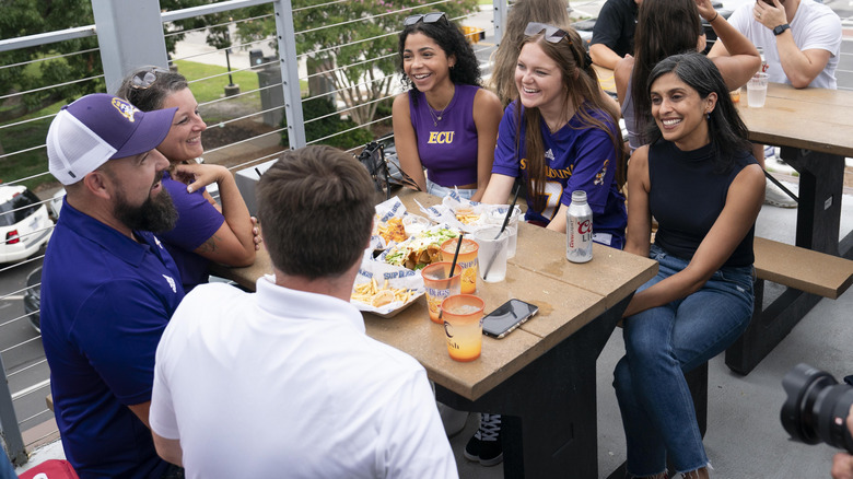 Republican vice presidential nominee, U.S. Sen. J.D. Vance (R-OH) and his wife Usha Vance talk to patrons at Sup Dogs restaurant on September 14, 2024 in Greenville, North Carolina (2024)