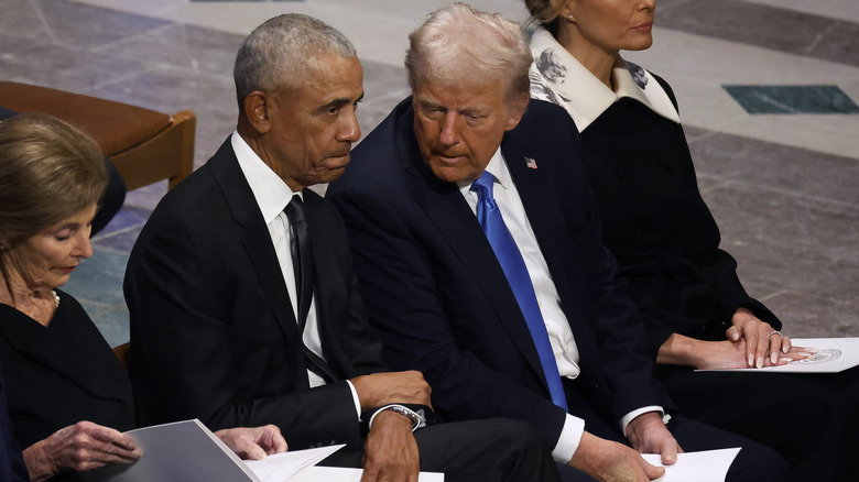 Barack Obama and Donald Trump at Jimmy Carter's funeral.