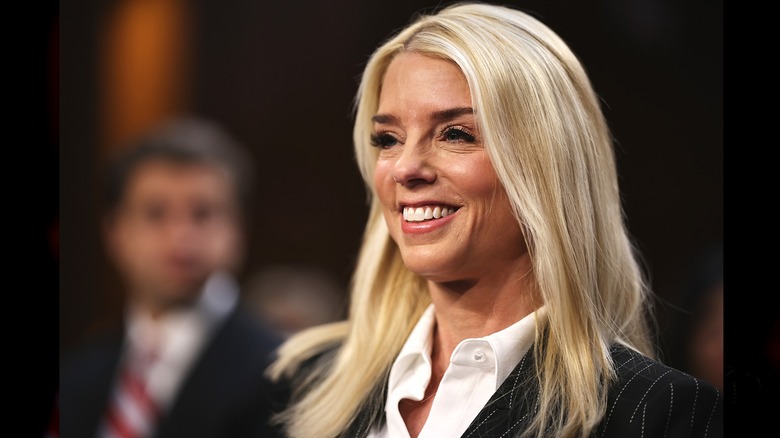 Pam Bondi smiling facing right