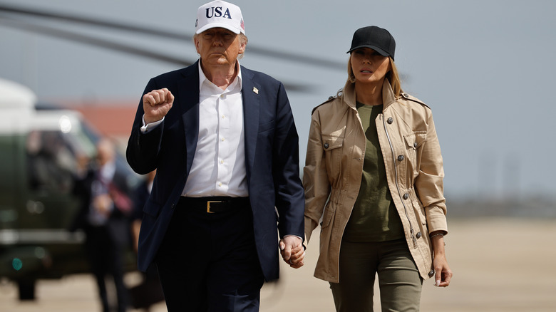 Donald Trump and Melania Trump walking hand in hand