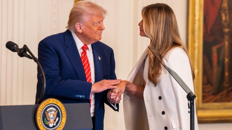 Donald Trump shaking Melania Trump's hand