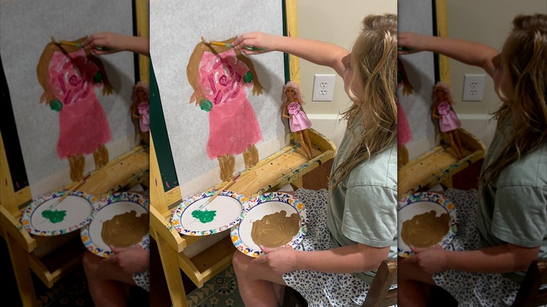 Erin Napier's daughter painting a picture of her Barbie