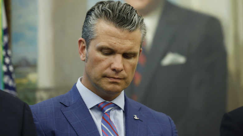 Pete Hegseth listens as U.S. President Donald Trump delivers remarks before signing a Presidential Memorandum in the Oval Office on September 15, 2025 in Washington, DC.