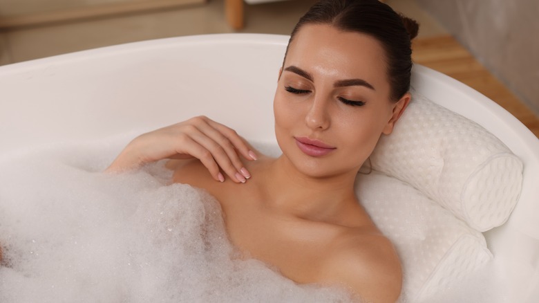 woman relaxing in bath tub