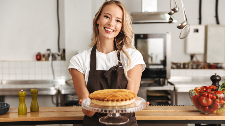 Woman holding apple pie