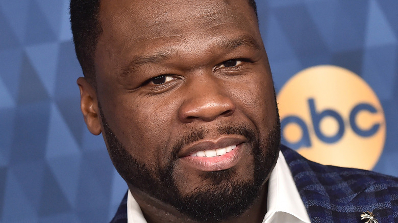 50 Cent posing at a red carpet event