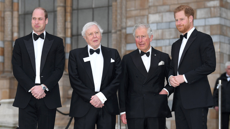 Prince William, David Attenborough, King Charles III, and Prince Harry at an event in tuxedos