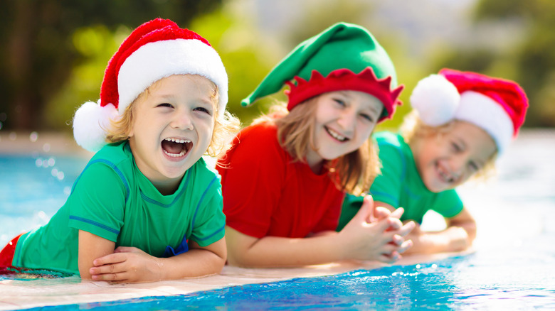 Kids at swimming pool in Christmas attire