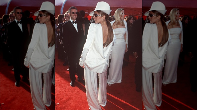 Celine Dion looking to the side with her back facing the camera