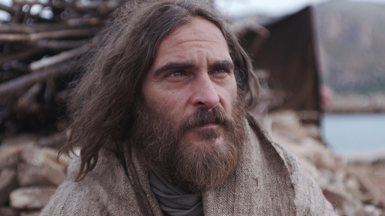 Joaquin Phoenix with long hair and a bushy beard in "Mary Magdalene"