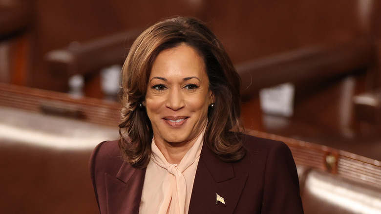 Kamala Harris smiling and looking to the side