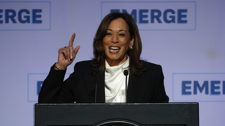 Kamala Harris speaking behind a podium