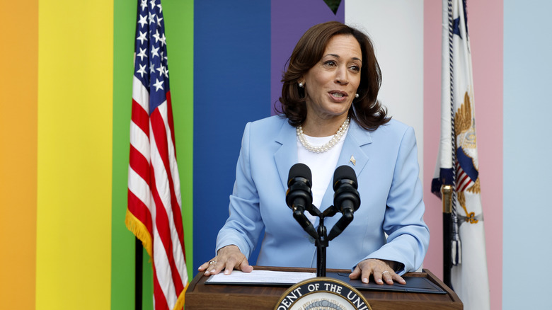 Kamala Harris with her hands on the podium