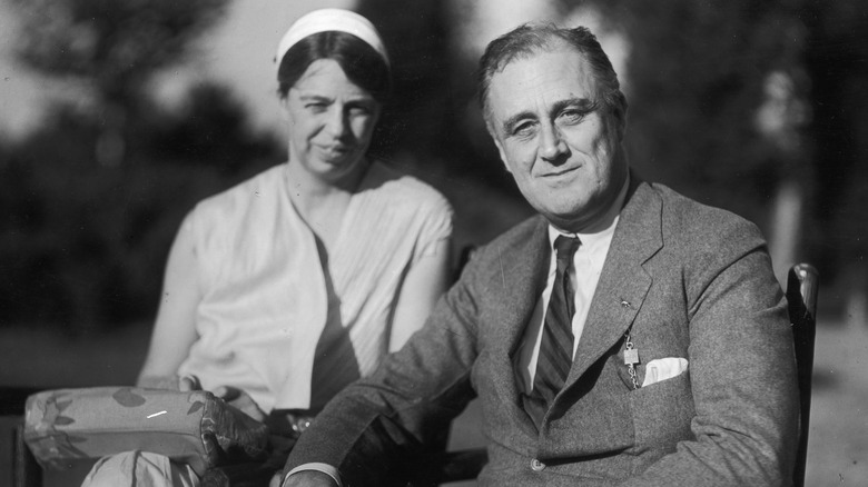 Eleanor and Franklin Roosevelt sitting together outside