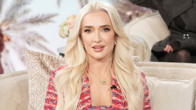 Erika Jayne smiling on set of 