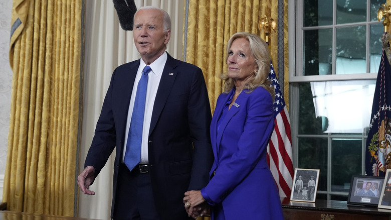 Joe Biden and Jill Biden standing next to each other in the Oval Office