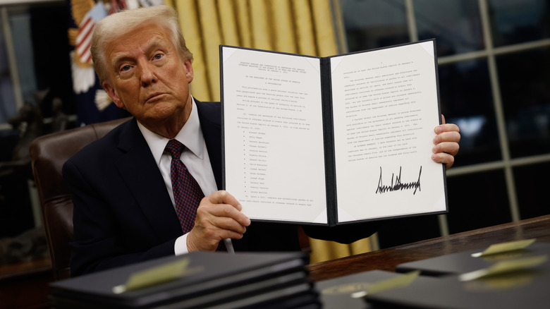 Donald Trump showing off a signed executive order
