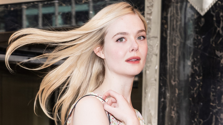 Elle Fanning with her hair blowing in the wind