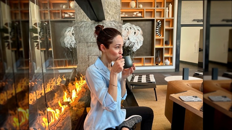 Autumn Reeser in a living room with a fireplace