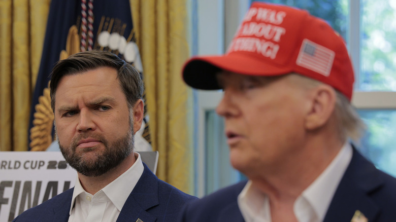 JD Vance glaring over his shoulder at an unfocused Donald Trump