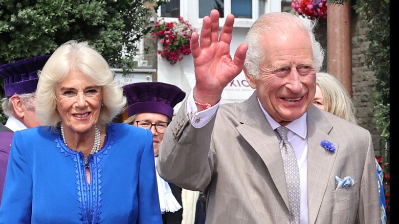 Queen Camilla and King Charles III waving