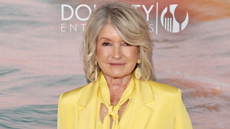 Martha Stewart in yellow jacket with neck bow