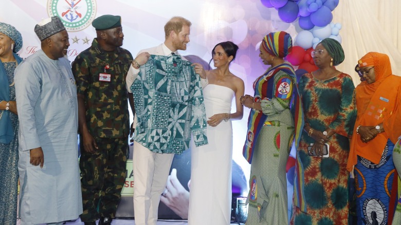 Meghan Markle and Prince Harry on stage in Nigeria
