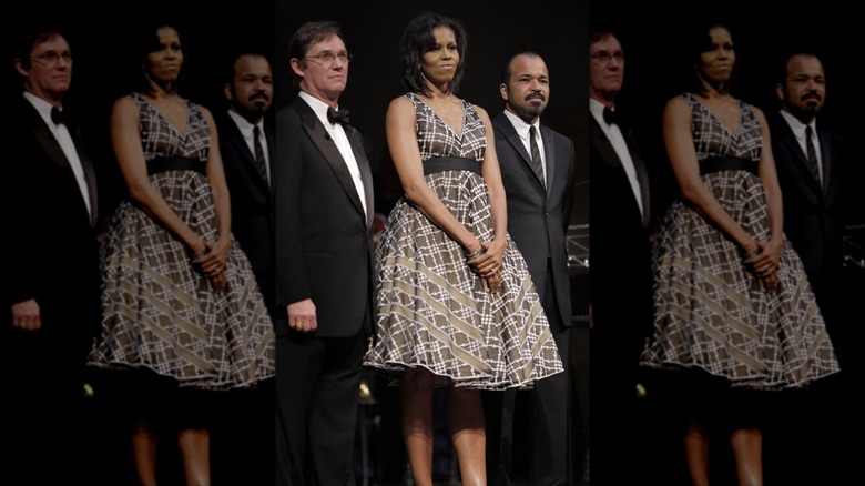Michelle Obama standing with others