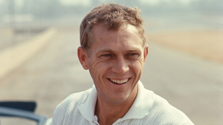 Steve McQueen with a broad smile on his face