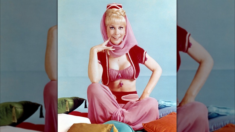 Barbara Eden wearing her I Dream of Jeannie costume, a pink genie outfit