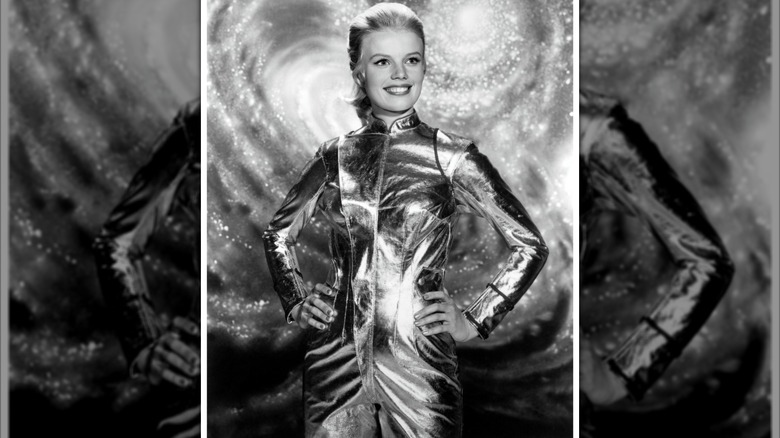 Marta Kristen poses in a metallic space suit
